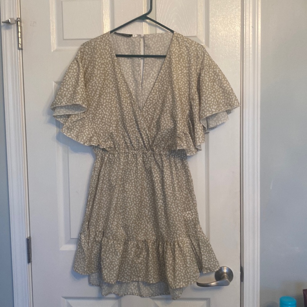 Tan and crème printed ruffle bottom dress